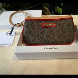 Calvin Klein brown with red accent wristlet